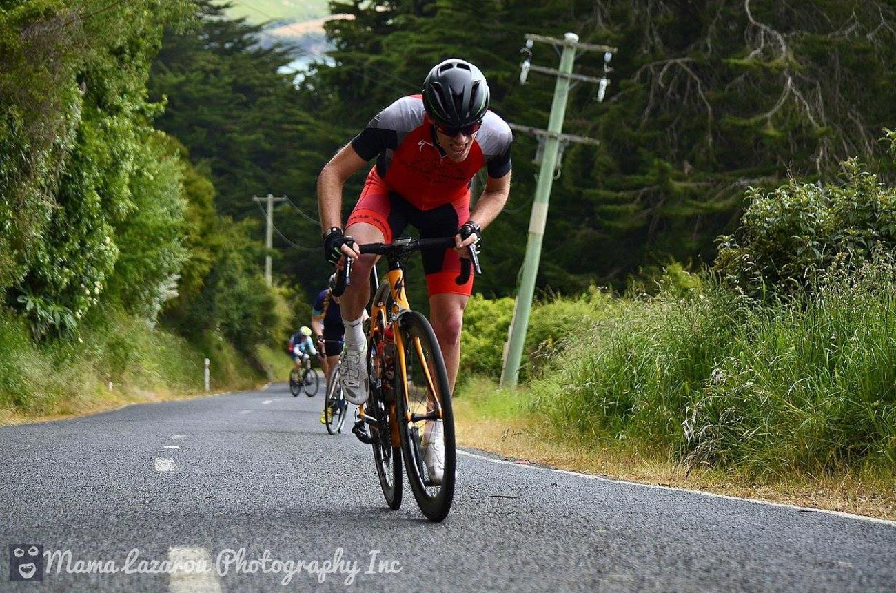 There\'s that grimace (gurn) again. This stretch of road near the city of Dunedin is known as \"The Wall\" and while it\'s only 24o meters long it has gradients of nearly 19% in parts. It hurts Photo credit: Mama Lazarou Photography https://www.facebook.com/Mama-Lazarou-Photography-Inc-123104847805880/